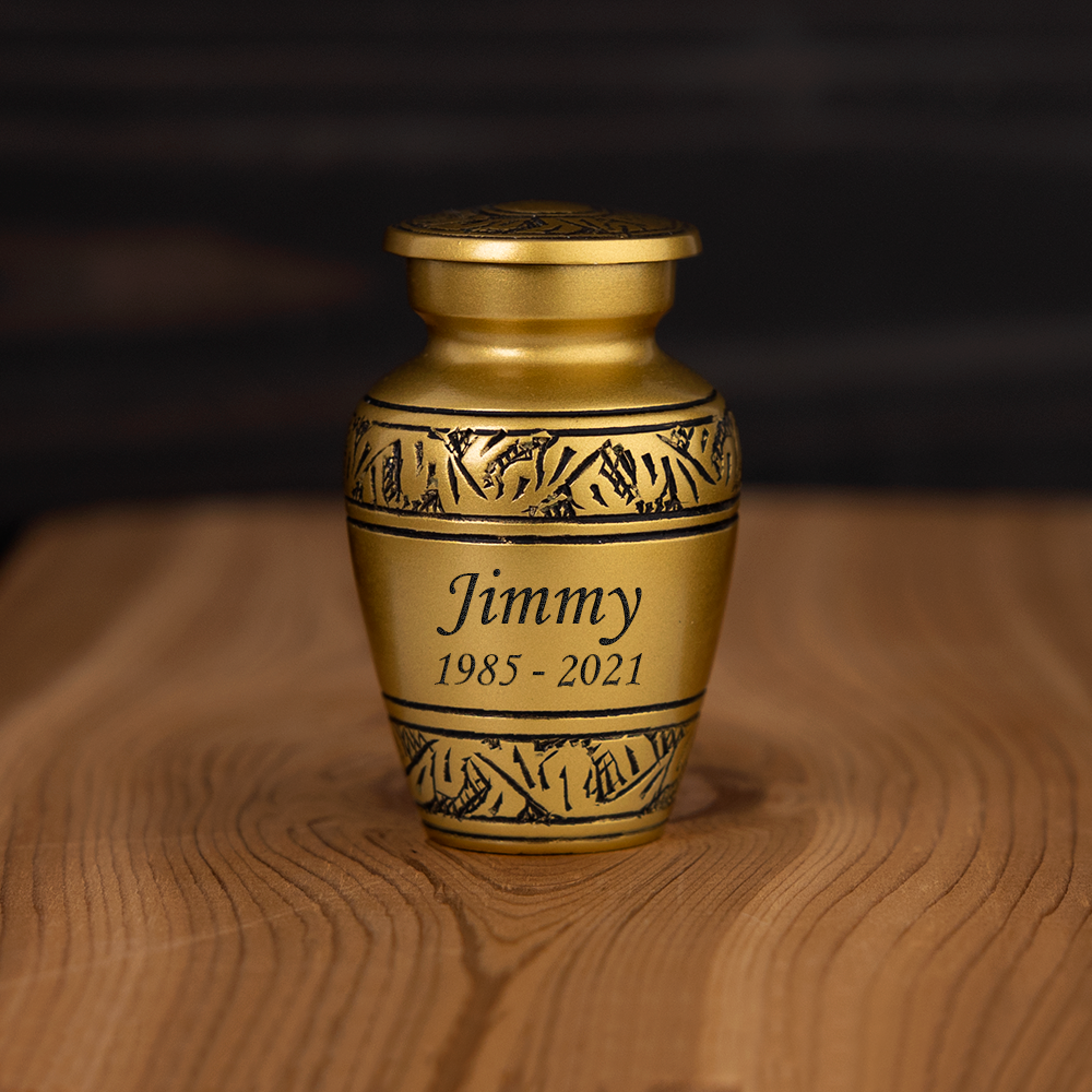 Gold metal cremation urn.