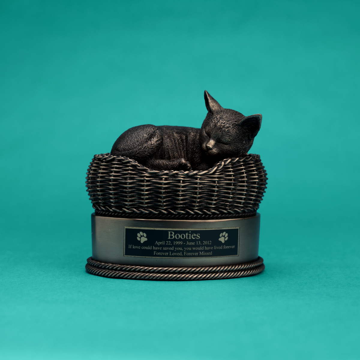 Bronze cat in basket cremation urn.