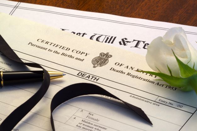 death certificate with white rose.