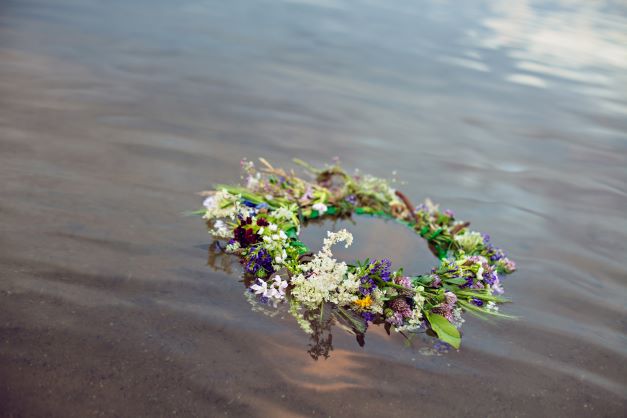 Flower arrangement floating in water.